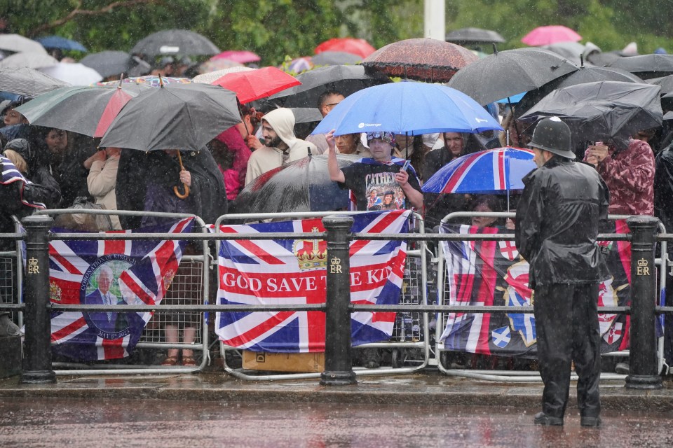 Fans had to try to shelter during downpours as they tried to get a glimpse of the royals