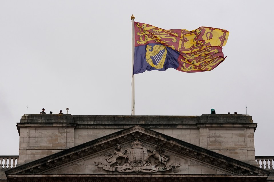 The Royal Standard flag is flying above Buckingham Palace