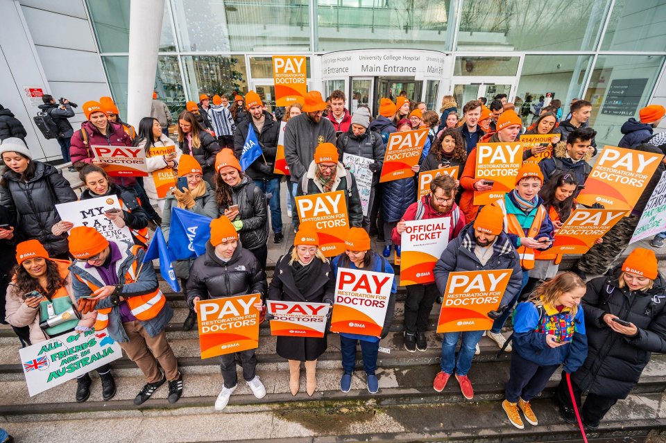 A picket line outside UCHL sings Christmas songs