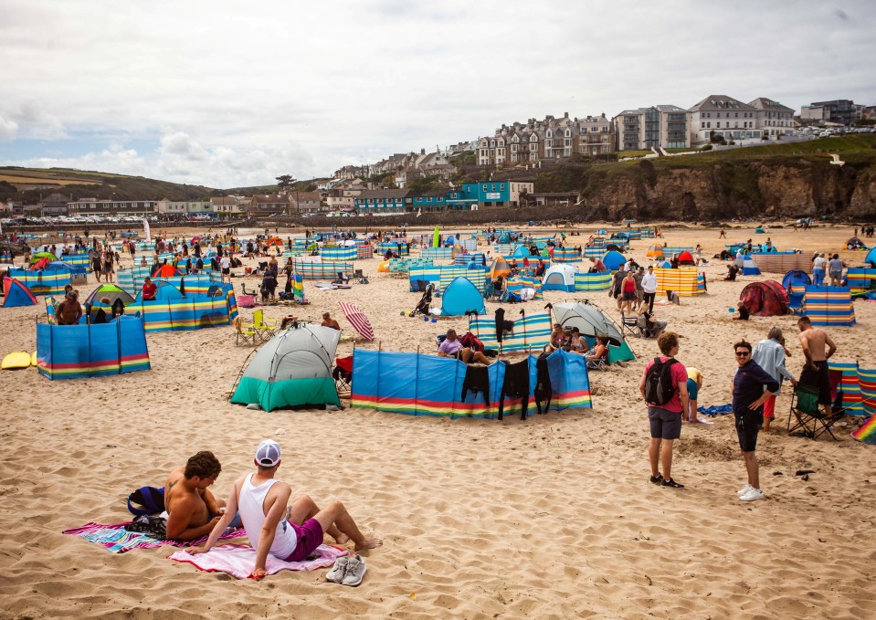 Tourists in St Ives, Cornwall soak up the sunshine at the hotspot