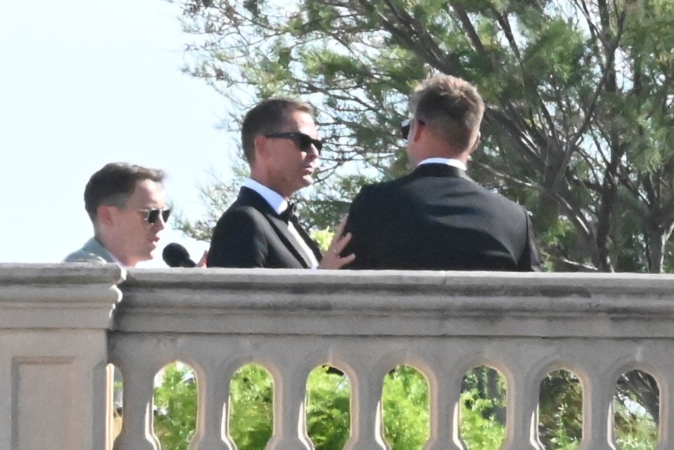 Scott gently placed his hand on his new husband's shoulder in support