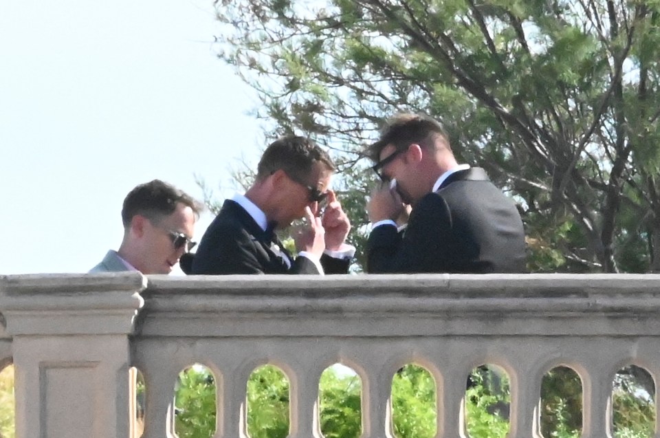 The grooms both took a moment and wiped their eyes during the ceremony