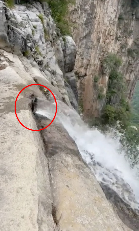 A tourist has spotted a pipe churning out water to feed the chute