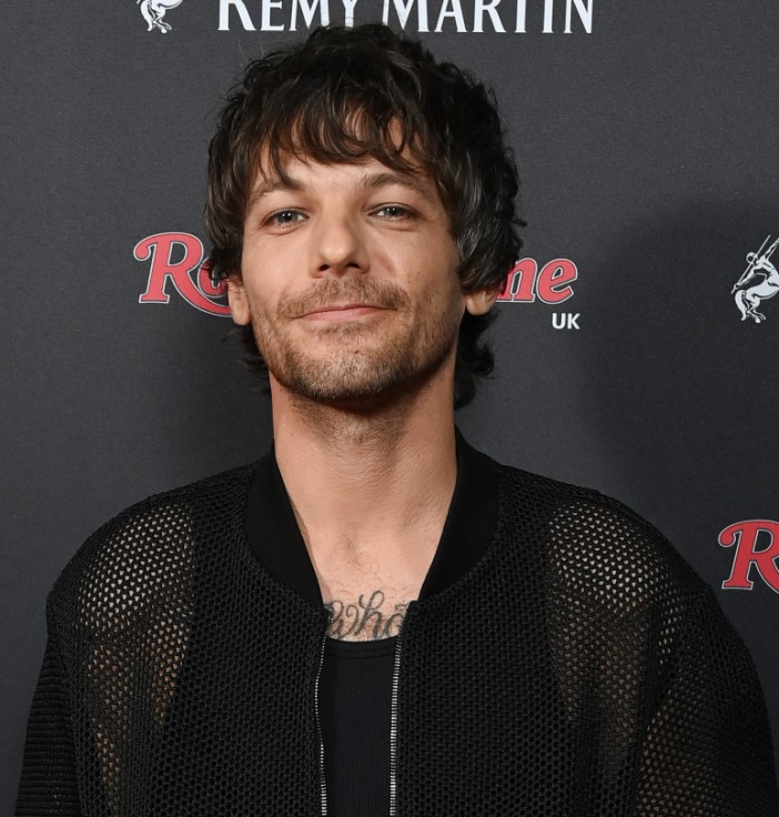 Louis Tomlinson brought not one but TWO televisions to Glastonbury to catch the football