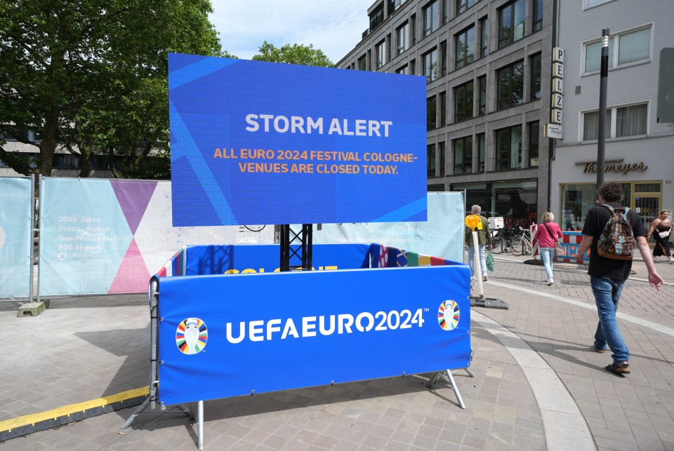 A sign in Cologne showing all fan parks are closed due to a storm alert