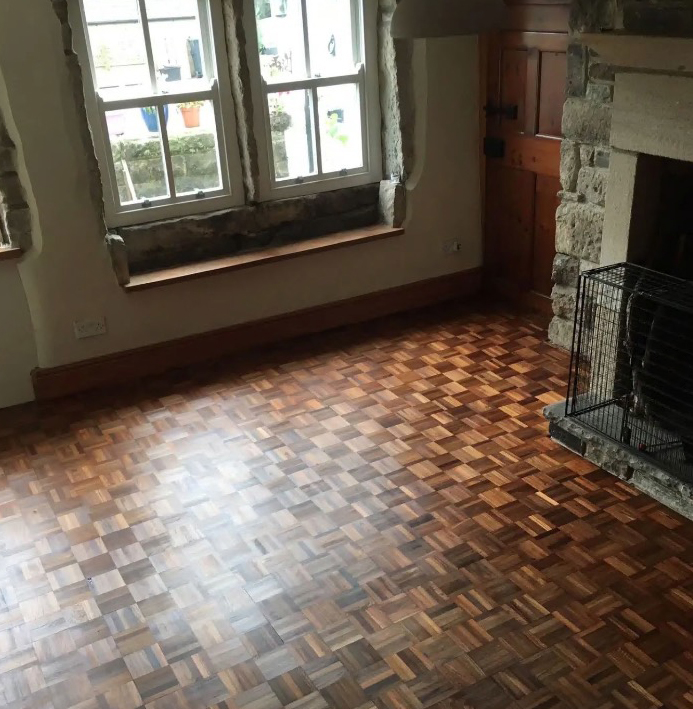 Their home contains cottage style windows and an elaborate stone fireplace