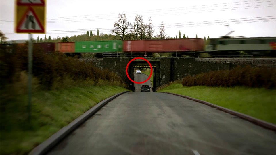 The tunnel in the first clip is too narrow for two cars to pass