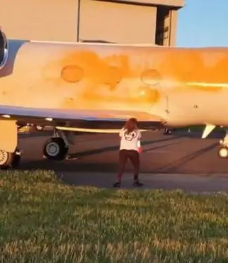 Protesters sprayed a private jet with orange paint