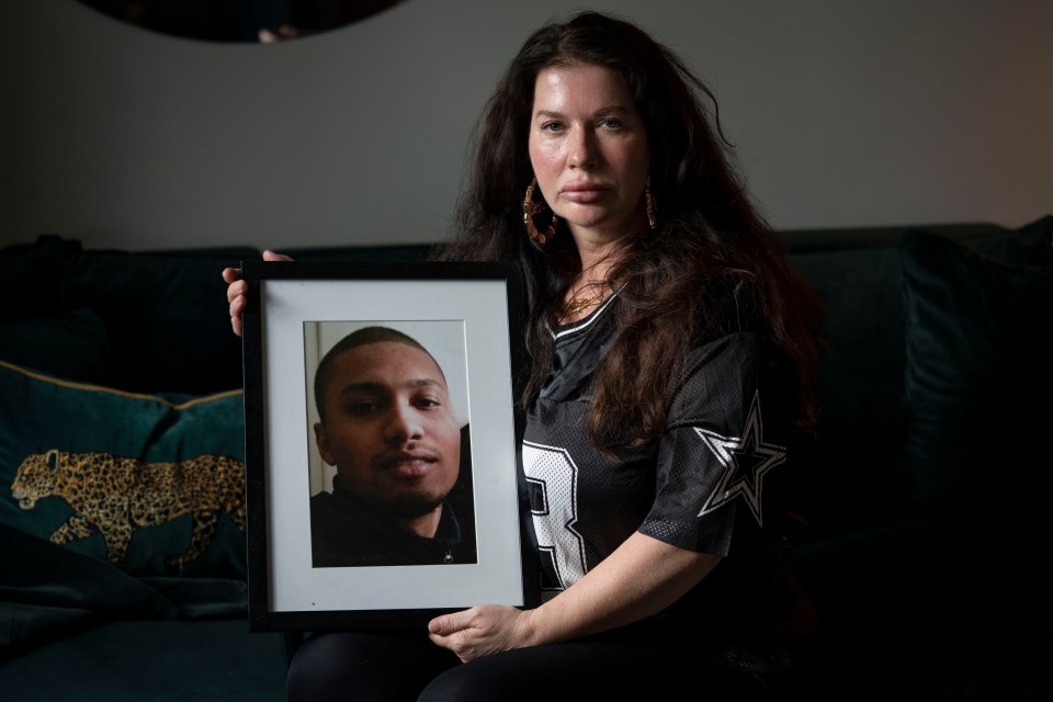 Maritha Ogilvie holds a photo of her son Marley, 24, who was shot and killed in 2015