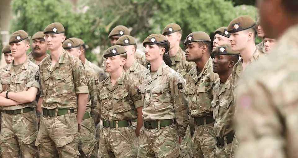 Soldiers listened in silence to the heartfelt message as they prepared for the ceremony