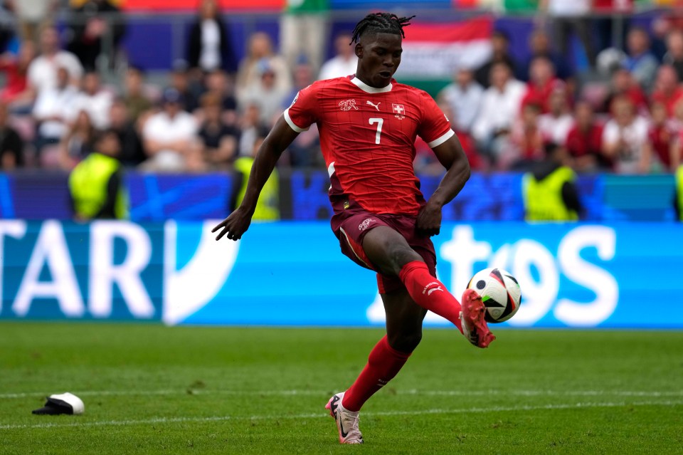 Embolo scored a chip goal for Switzerland's third but left some clothing behind