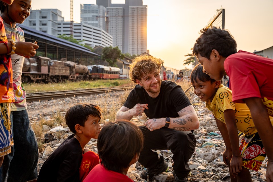 Children in the area play football on railway tracks