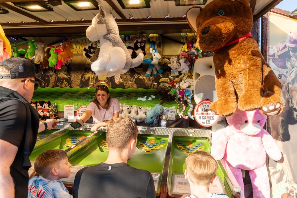 Carnival games and stalls are on offer alongside rollercoasters