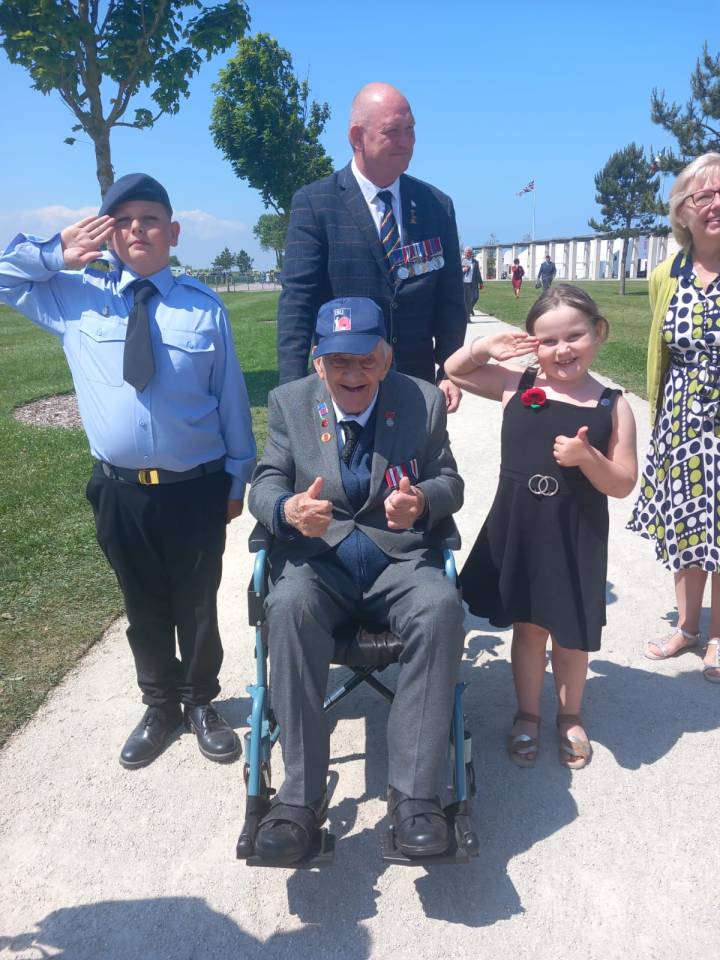 The plucky kids also made sure they snapped a picture with one of the day's real heroes