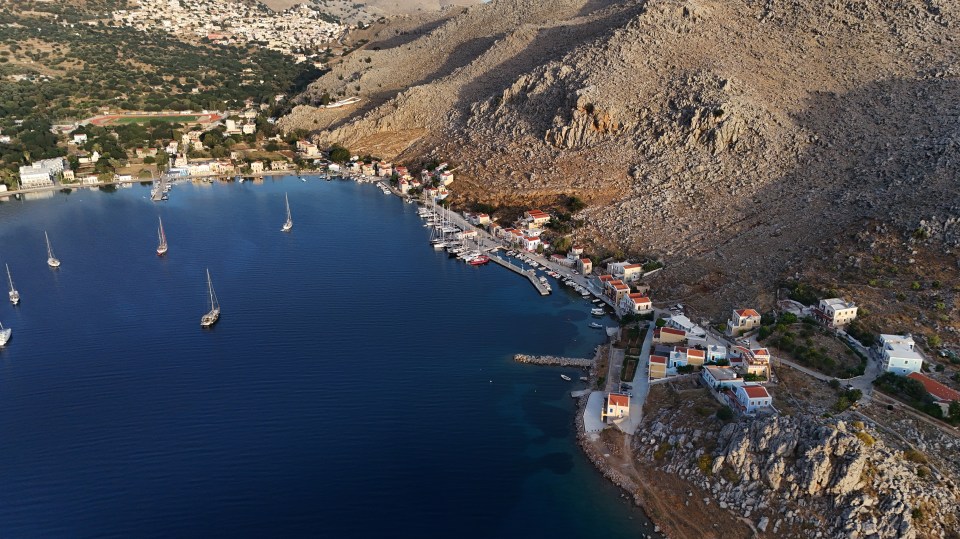 Pedi, a small fishing village in Symi, where a search and rescue operation is under way