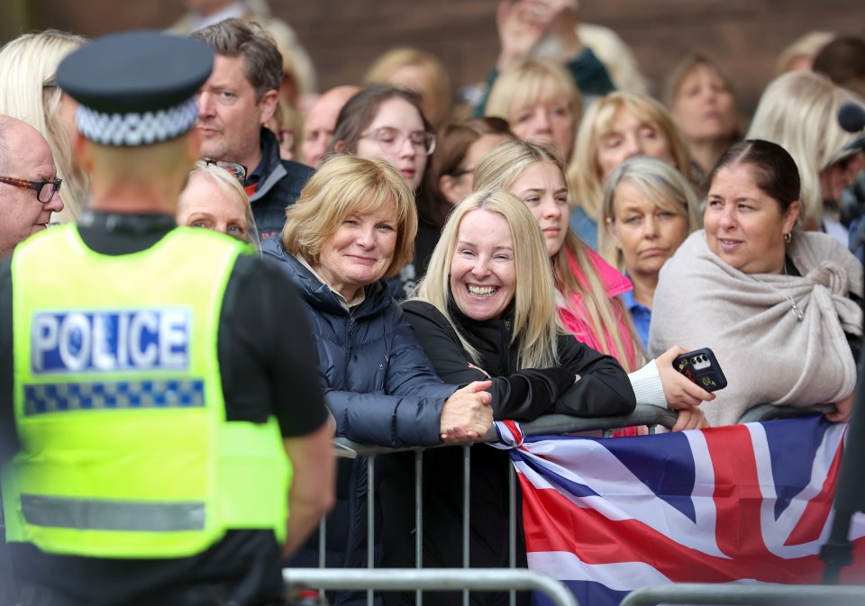 Crowds held Union Jacks as they waited to see the happy couple