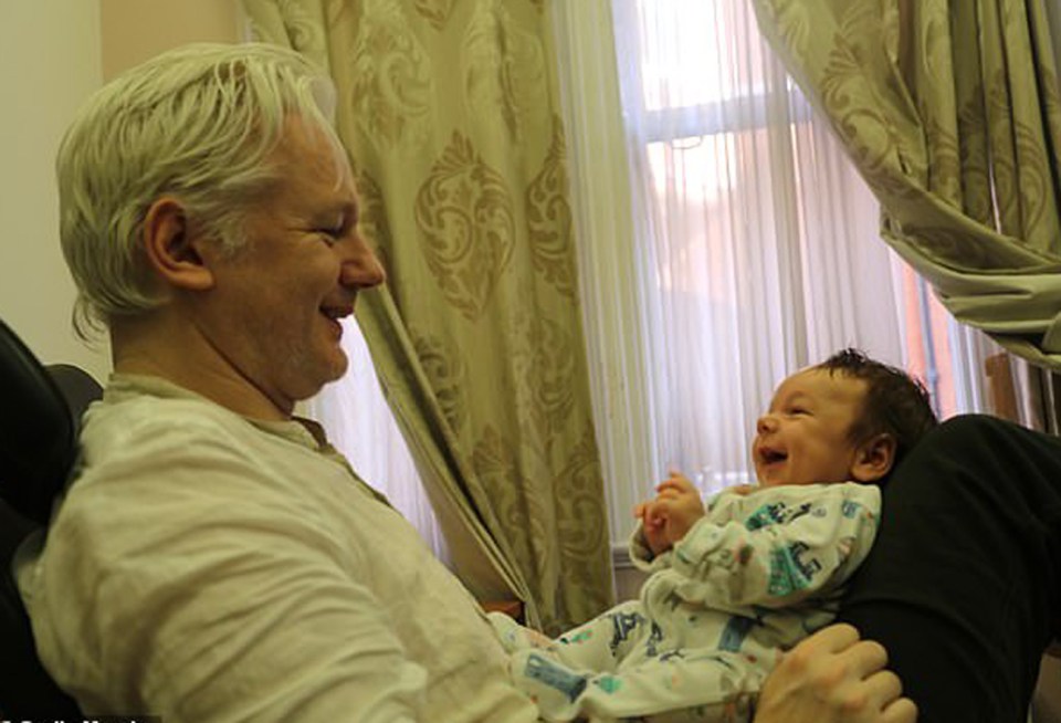 Assange with his first son Gabriel, who is now seven years old