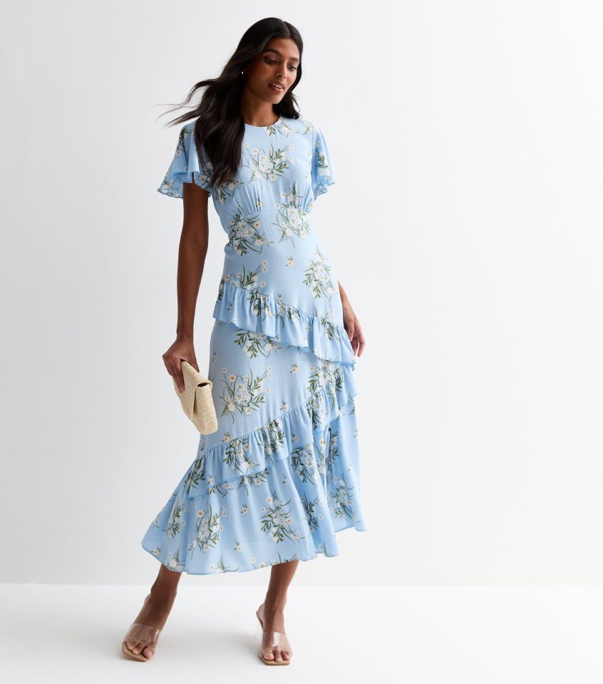 With it's ruffles, fluttery sleeves and delicate floral print, this dress is super feminine