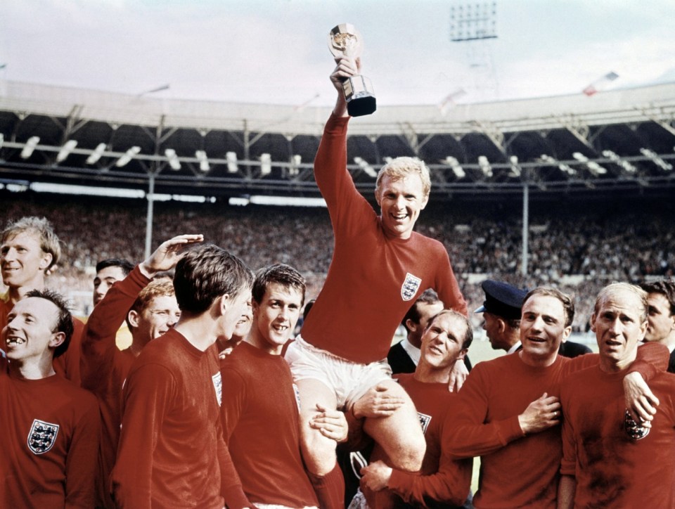 World Cup Final at Wembley Stadium, England versus West Germany. Captain Bobby Moore holds aloft the Jules Rimet trophy as he sits on the shoulders of his teammates. They are Jack Charlton, Nobby Stiles, Gordon Banks, Alan Ball, Martin Peters, Geoff Hurst, Ray Wilson, George Cohen and Bobby Charlton. 30th July 1966. (Photo by Daily Mirror/Daily Mirror/Mirrorpix via Getty Images)