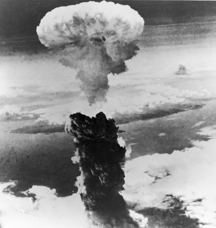 a black and white photo of a mushroom cloud in the sky