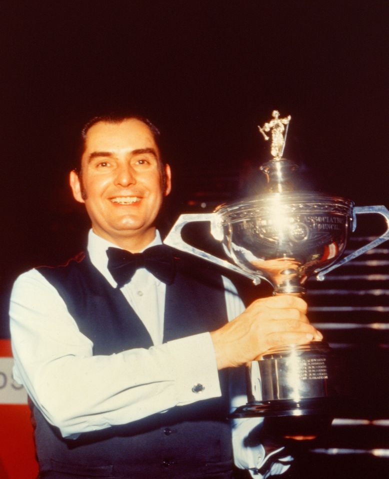 a man holding a trophy that says ' championship ' on it