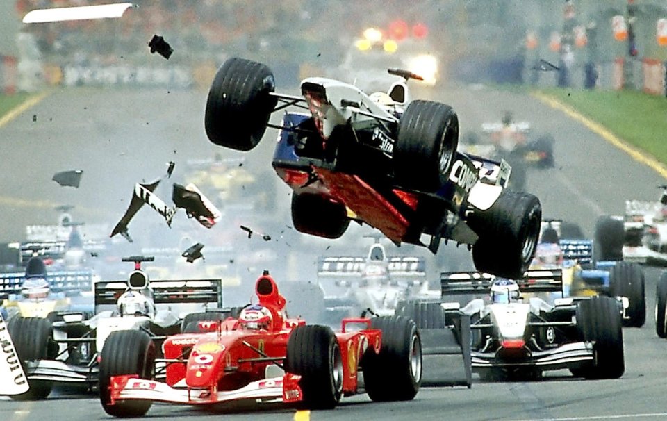 Ralf's car is launched in the air over Ferrari driver Rubens Barrichello of Brazil in 2002