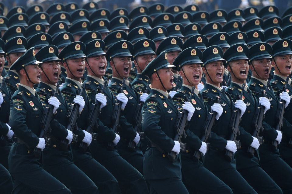 Chinese troops march in Tiananmen Square in Beijing to mark the 70th anniversary of the founding of the China