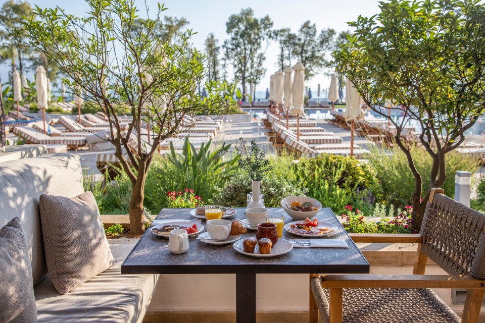 a table with plates of food and drinks on it