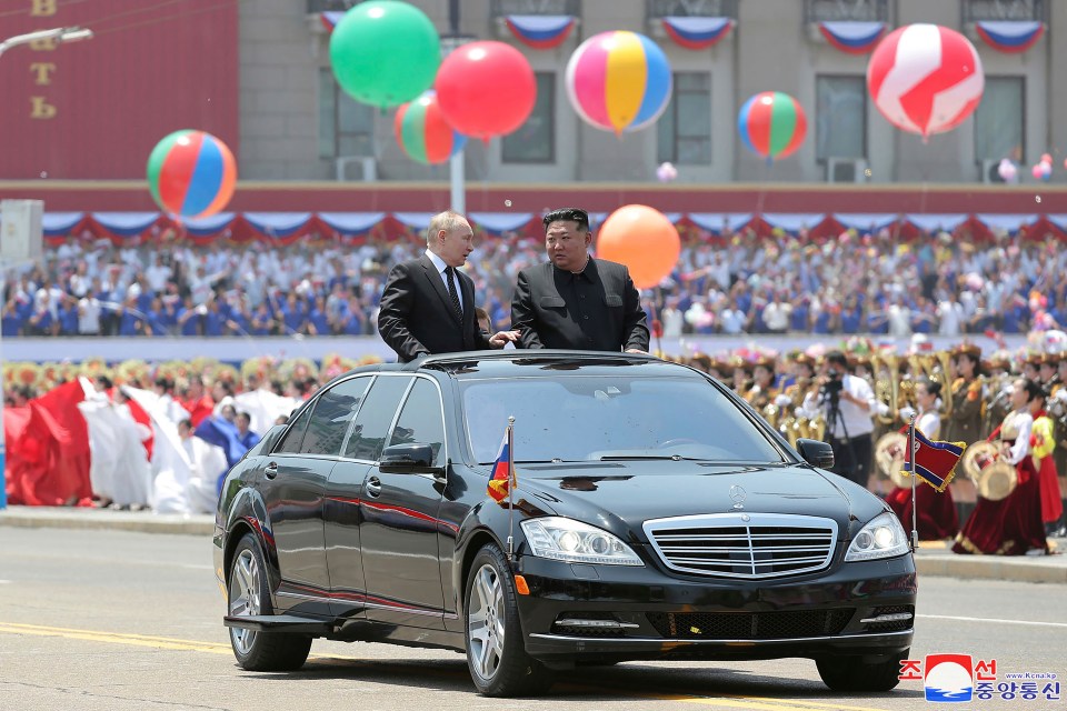 The Russian leader was greeted by colourful balloons, flowers and flags