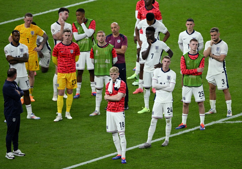 Dejected England stars watched on as Spain lifted the trophy