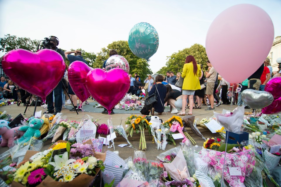 Flowers and messages left at the vigil tonight