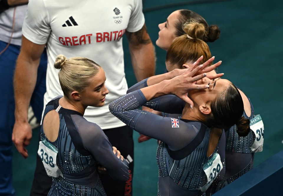 a group of gymnasts with one wearing a shirt that says great britain