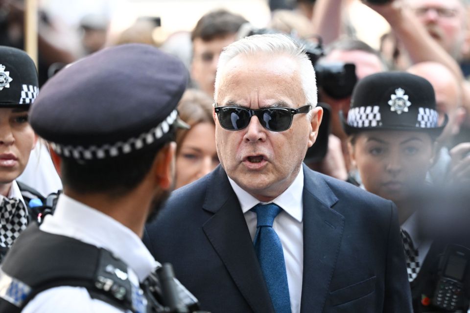 He wore sunglasses and a smart suit as he made his way into the court