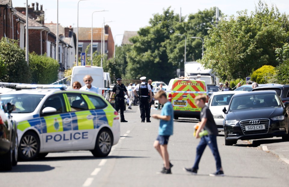 a police car is parked on the side of the road