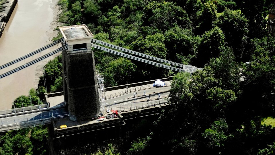 an aerial view of a bridge over a river