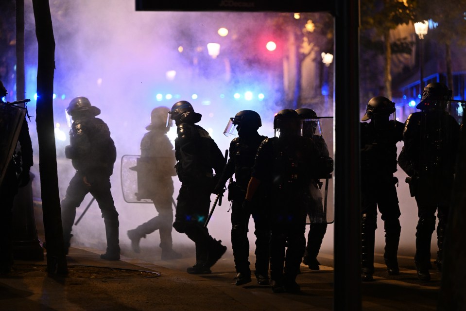 Riot police were deployed to the streets in and around Paris