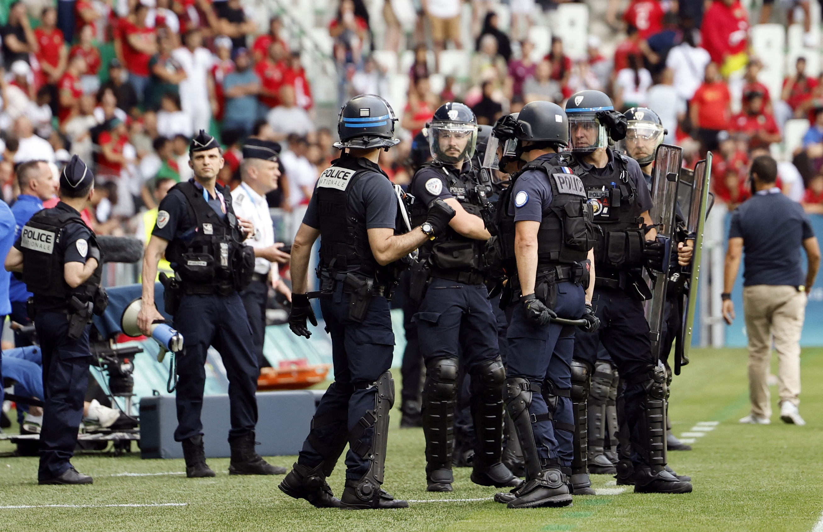 The match was suspended before the goal was disallowed as fans swarmed the pitch