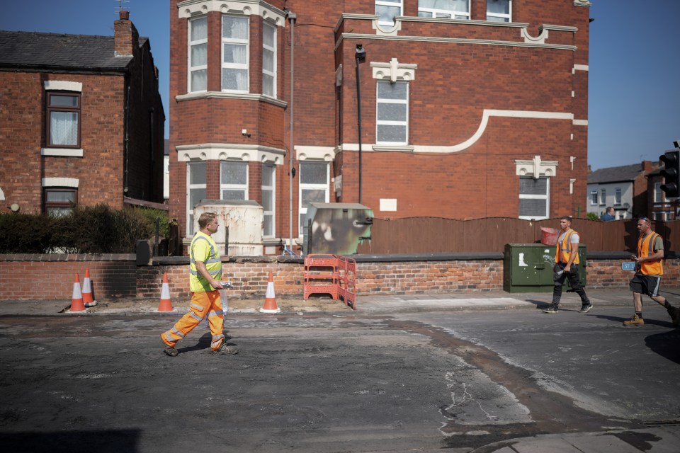 Workmen set about repairing a damaged wall