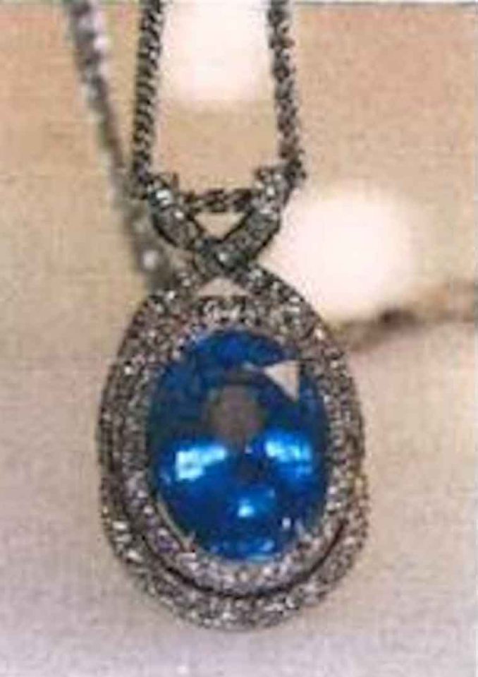 The victim was hit over the head before the masked raider fled with around 50 items of jewellery, including this sapphire pendant