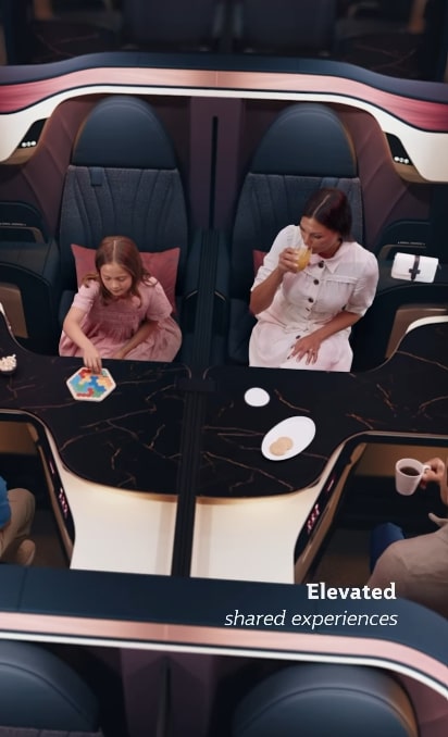 an advertisement for elevated shared experiences shows a woman and child sitting at a table