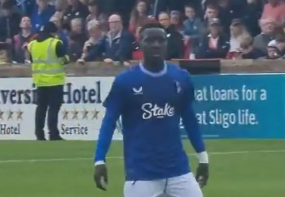 a soccer player wearing a blue shirt with the word stake on it