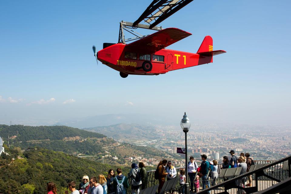 Avio offers rides in small red planes overlooking to park