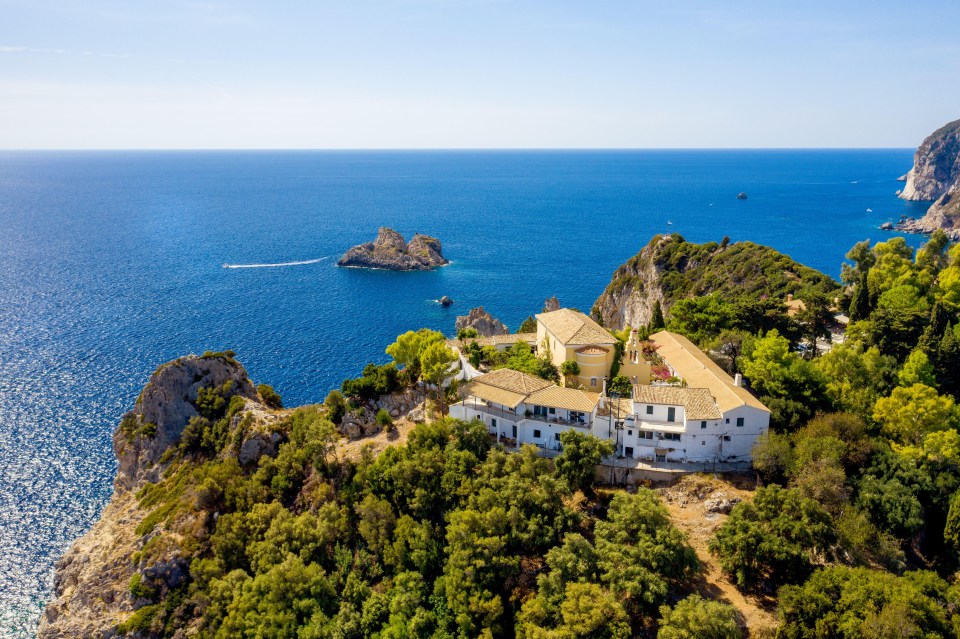 an aerial view of a small island in the middle of the ocean