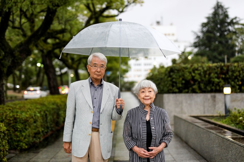 Hiroshi Shimizu (left) told how they were banned from speaking about what they saw