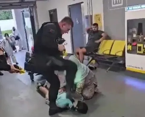 The officer appears to stamp on the man's head after kicking him in the face