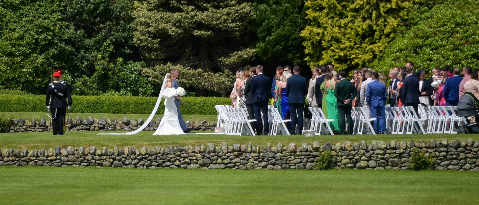 a bride and groom are walking down the aisle at their wedding