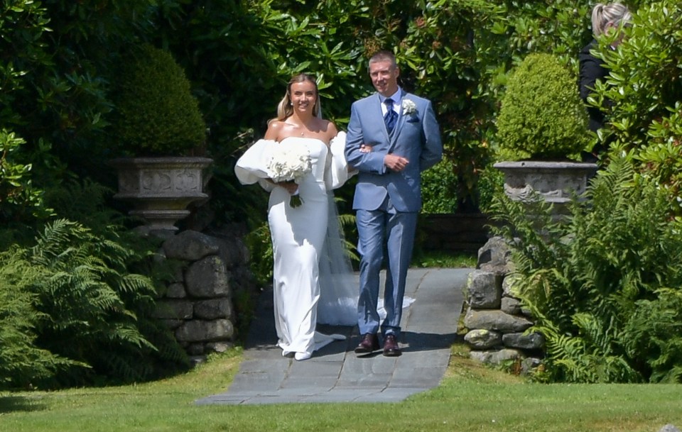 a bride is walking down the aisle with her father