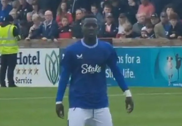 a soccer player wearing a blue shirt that says stake on it