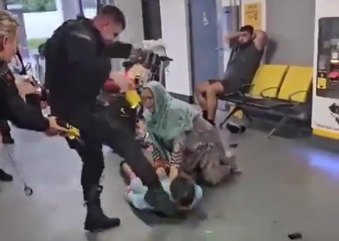 A police officer stamped on a man's head on Tuesday