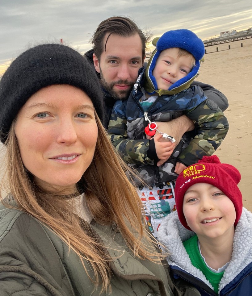 Eddie (right) with mum Harri, dad Jamie and brother Leo